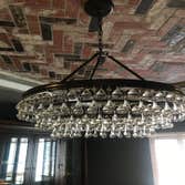 Installation of stone on ceiling with special pattern and chandelier installation