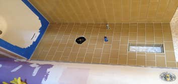 San Francisco Bathroom remodel Complete remodel of a 100 wear old bathroom. There is blue mask covering the new tub for protection during constructio