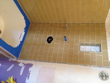 San Francisco Bathroom remodel Complete remodel of a 100 wear old bathroom. There is blue mask covering the new tub for protection during constructio