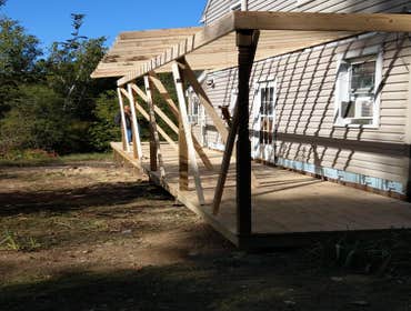 161 mullberry st deck and landscape renovation Removed small deck and wooden walkways replaced with bigger wrap around deck with roof,composite steps,a
