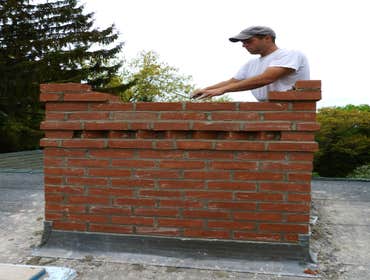 Chimney Rebuild with Dovetail Detail and Raised Stone Cap, Hadley Simmons Masonry rebuilt this magnificent large chimney in Hadley. It was rebuilt fro