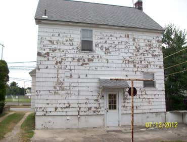 Brilliant Painting, LLC Exterior Project 1 Before and after photos of a full house that has been power washed, scraped, hand sanded, primed, and painte