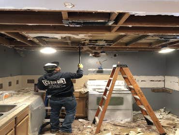 Photos by Enova Renovation #3 Removed damaged ceiling and wall. Discontinued appropriate wiring and plumbing, hauled away damaged material.
