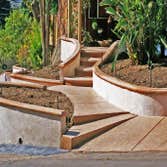 Infinity Construction And Design Inc Project Steps and hardscape. Outdoor lounge with fireplace. Backyard patio space and waterfalls. Landscaping arour