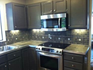 Lake Stevens Kitchen Remodel We installed a porcelain tile counter top and backsplash accented with aluminum strips and squares. Aluminum flat bar was