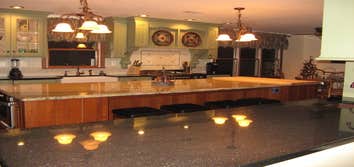 Chester Kitchen with Entertaining Island This fabulous remodel features custom green painted and glazed cabinets along with a cherry island and refrige
