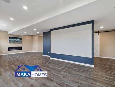 Photos by Maka Homes Inc #1 2000 sq ft with bathroom, bar, gym, theatre, and bedroom.