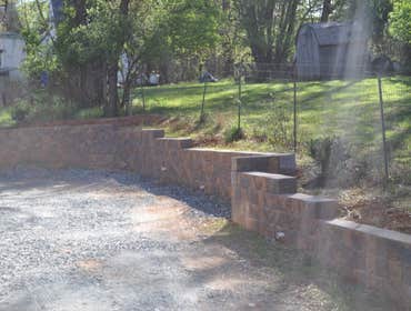 Retaining wall and patio in Potomac, MD This is a segmental retaining wall and backyard redesign we are currently working on in Potomac, MD