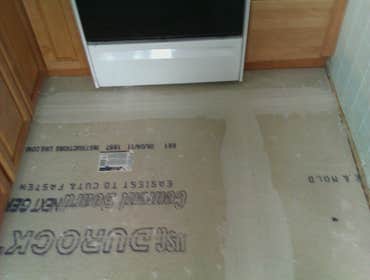 Photo(s) from Laur Moor Construction Two decks and a tiled kitchen floor