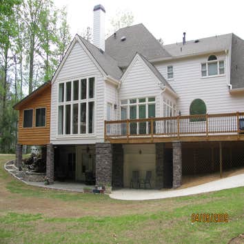 Photo(s) from Home Renovations & Remodeling Wall of windows great room addition, deck & cypress porch with stone water fall, pond & patio