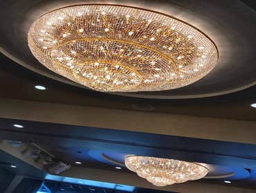 Photos by The Tradesman Electric #1 Install two custom wall sconces and add four LED can lights to the soffit area.