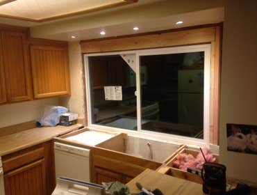 New window and counter tops with new canned lights Small Kitchen Remodel New window and counter tops as well as out side matching Bar
