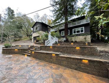 Photos by Souza & Sons Inc #3 Front yard demolition and renovation of a new driveway, retaining walls, lighting and veneers
