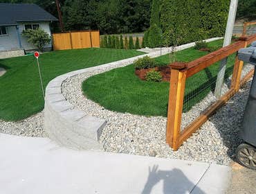 Photos by Rmj General Contractors LLC #2 Renovation of front entrance of property including new concrete driveway, SOD, Fence, Retaining wall, gravel, 