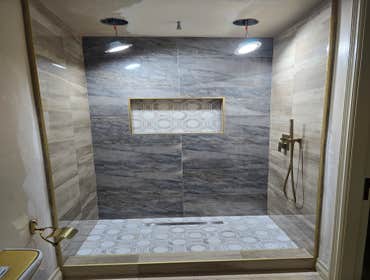 Photos by MC ALISTER TILE #1 5 showers total, was hired after another handyman did not water proof correctly, fixed all water proofing and installed 