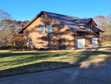 Photos by Dl Construction, Inc #4 New garage with kitchenette, living room, full bath and two bedrooms above