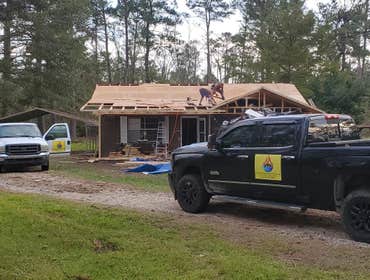 Photos by Service Restoration Pros LLC #1 A tree fell through the roof of this 3 bedroom house during Hurricane Ida. It left several gaping holes and a