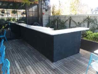 Roof deck Bar Outdoor bar with special accomodation for winter shut down. Custom millwork, tile and stone counters