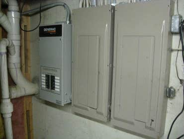 Transfer switch beside 2 panels