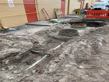 Restaurant build-out Installation of a 750 gal grease trap.