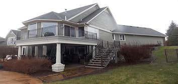 Deck/ Eden Prairie Bear Path GEM ! PVC Decking wrapped with accent boarder to mach homes exterior. Custom made Handrail to match style and color of ex