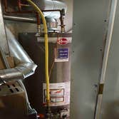 Water heater with water alarm