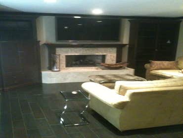 J C M Construction Project Installation of all new wood flooring and tile throughout house. Installation of fireplace tile, new kitchen counter tops, 