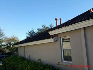 Photos from Popa Construction LLC Before & Afters of a soft wash roof cleaning and driveway and side walk cleaning.