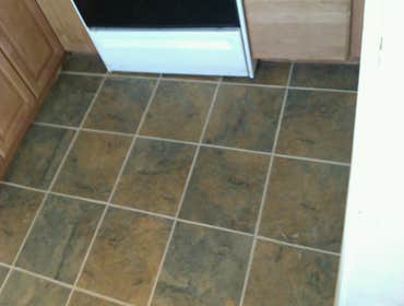 Photo(s) from Laur Moor Construction Two decks and a tiled kitchen floor
