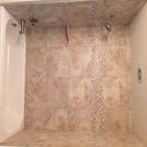 Showers & Bath Surrounds Here are a few separate projects...ranging from white subway tile to large format porcelain with either decorative bands or ni