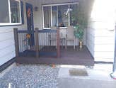 Trex deck Demo and remove old brick flower pot, build frame and install trex decking and handrail system
