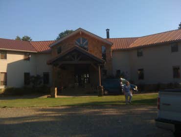 Photos by Accuflo Company #3 Copper colored roof vinyl siding and imitation stone siding