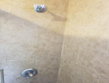 Bathroom remodeling Complete renovation of bathroom. Removed old bath tub and installed standing shower. Replaced toilet, vanity, mirror, lights, d