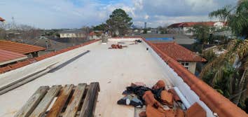 Photos by Gerdes Architectural Roofing, Spanish Tile / TPO Roof Replacement