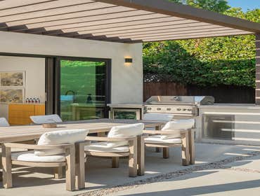 ADU Conversion We transformed an unused backyard and garage into a beautiful oasis for a client. A welcoming open floor plan with custom white oak pane