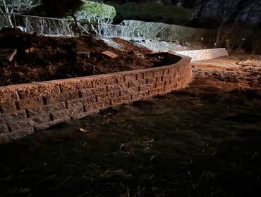 Photos by Lms Construction and Remodeling Retaining Wall Remove existing retaining wall destroyed by fallen tree
Regrade hillside
Regrade lawn
Rebuild 
