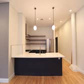 Luxury Apartment Luxury Apartment kitchen and bathroom remodel. In additional we replace the carpets with hardwood floors.