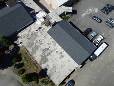 Isaac Roof Construction Commercial Roof Project Flat roof replacement with a minimum R-value of R-30 and a Class A Fire rating.
