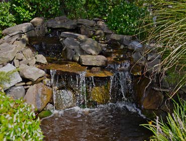 Scarsdale Waterfall by MG's Lawn Green Inc This is a waterfall that MG's Lawn Green designed and installed for a homeowner in Scarsdale, NY.