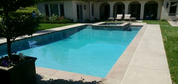 Photos by Lamont Enterprises #2 Design & construction of new pool with moated spa.