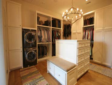 Dream Closet This closet was designed with total organization and convenience in mind. Creating a space for the washer and dryer brought an added leve
