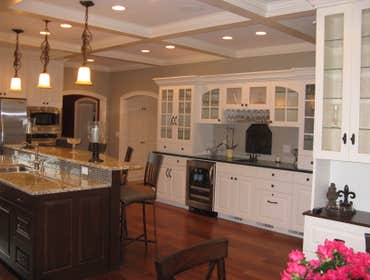 A kitchen/living room remodel in Edina Mn Enamled all cabinets, windows and wood trim. Painted all walls and ceilings.