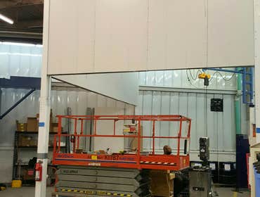 Curtain Wall Installation Commercial Curtain wall installation to help reduce sound from new equipment