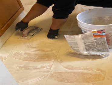 Photos by Woodside Construction Inc #5 Two days project approximately 10'X5' area replaced with 12"x12" Tiles. prepaid with moisture protection sheets,