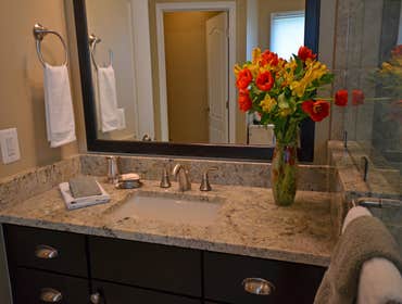 Project photos from Summit Design Remodeling This master bathroom remodel in Ashburn, VA included a his and hers vanity. The shower was enlarged quite