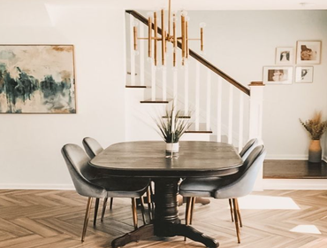 Dining Room Design Included the refinishing of a sentimental dining room table, dining chairs, artwork, lighting and flooring.