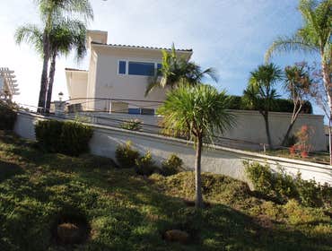 Chris Matthews Painting Project Exterior painting of two-story home and exterior wall fence, staining of deck, stairways and doors. San Diego, CA