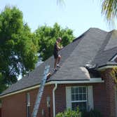 James Neill inspecting a roof