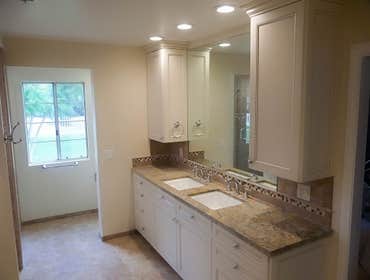 2014: Traditional Thermofoil Glazed Bath While the primary focus for this project was the remodel of the master bathroom, we did replace the flooring i