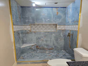 Photos by MC ALISTER TILE #1 5 showers total, was hired after another handyman did not water proof correctly, fixed all water proofing and installed 